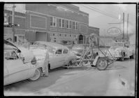 Man with pig; Car wreck (4 Negatives), June 22, 1957